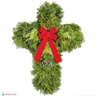 Cross-shaped evergreen wreath with white background.